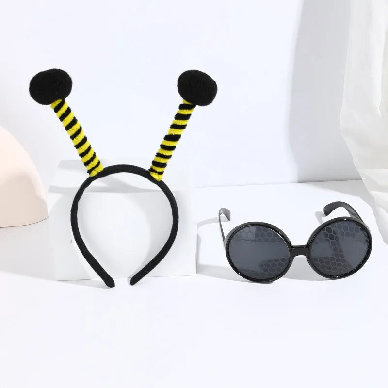 Yellow children's costume headband and glasses set with bee, butterfly, and ladybug patterns.