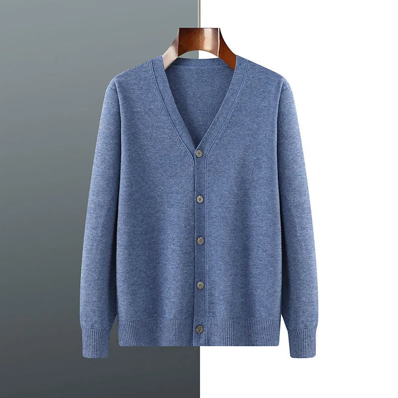 Man wearing a loose V-neck cardigan coat in Andy Velvet fabric, showing the long sleeves and available colour options.