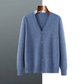 Man wearing a loose V-neck cardigan coat in Andy Velvet fabric, showing the long sleeves and available colour options.