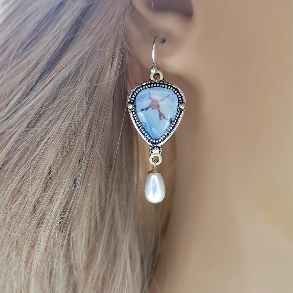Retro blue geometric drop earrings with synthetic opal and white pearl details on electroplated metal.