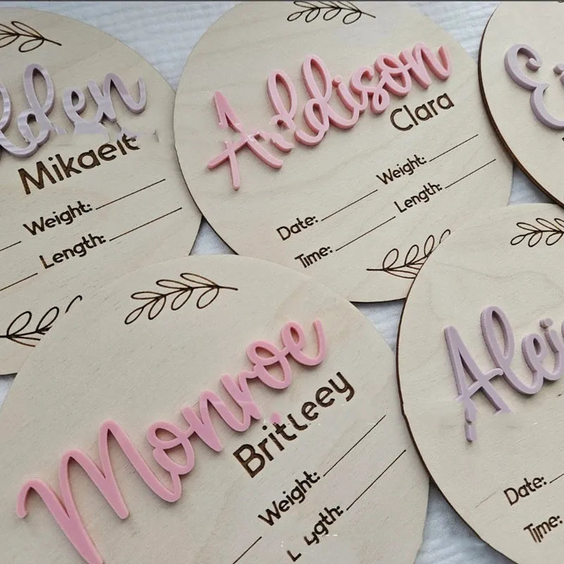 Square wooden baby name plaque showing birth information, 15cm on each side.