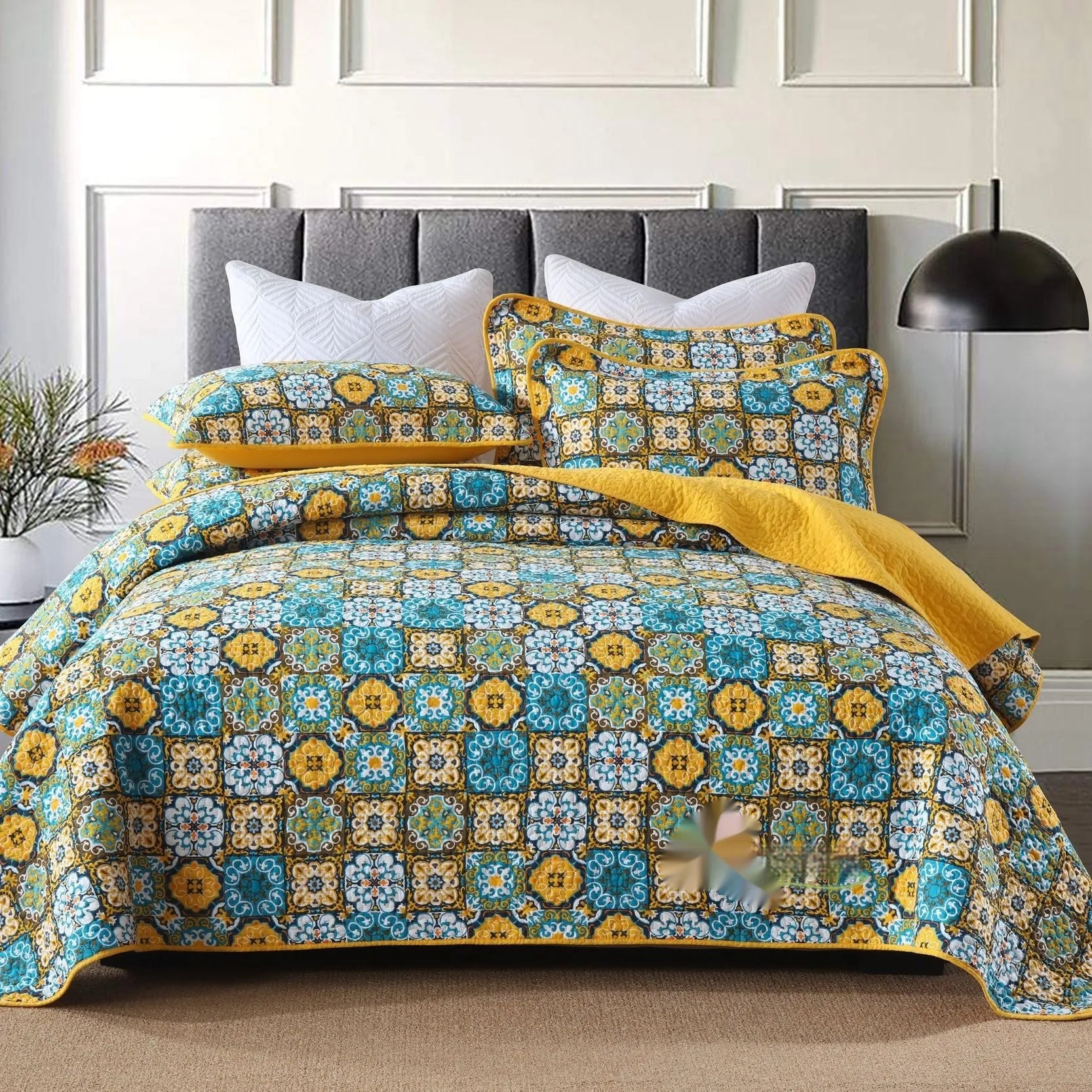 Quilted pure cotton bed cover set with printed pattern on a bed, includes two matching pillowcases.