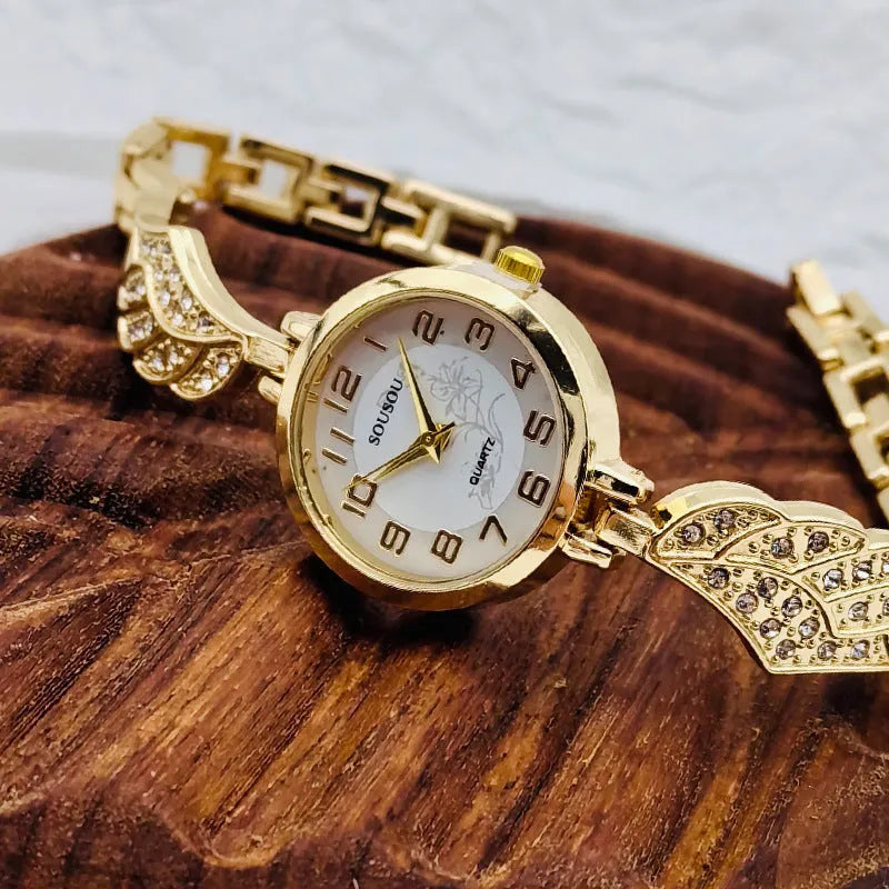 Stainless steel ladies watch with round dial on metal strap with Vachette clasp