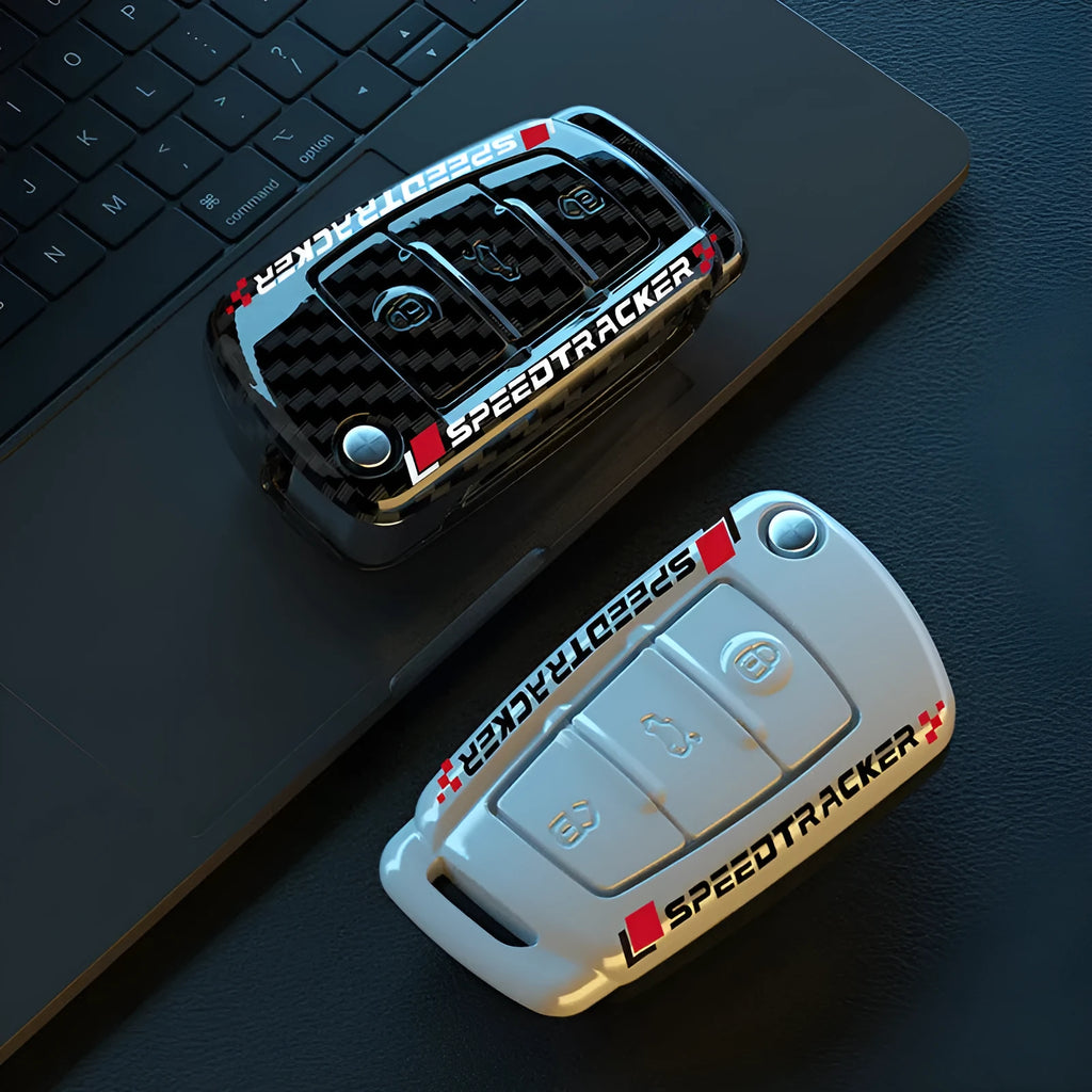 White and carbon coloured car key holders with a carbon fibre texture and mirror surface.
