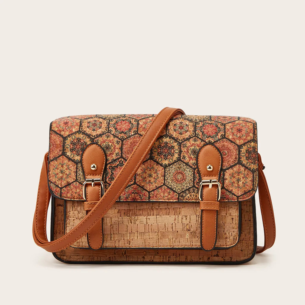Women's large crossbody bag in a printed PU material with a single shoulder strap.