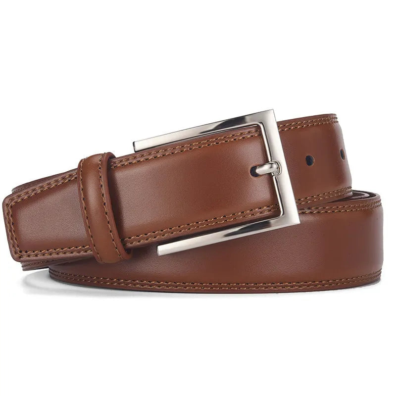 Men's black genuine leather belt with a silver alloy pin buckle on a flat surface