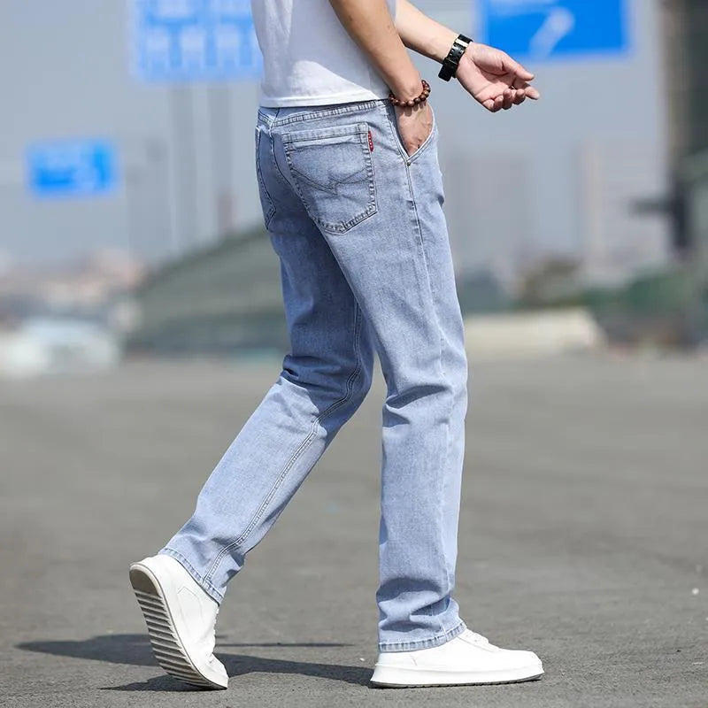 Men's smoky grey autumn jeans with straight tube fit and low waist design on hanger