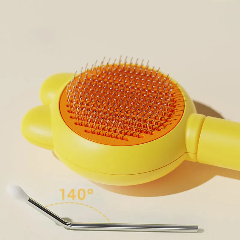 Self-cleaning pet grooming brush with green handle and stainless steel comb, showing the one-click release button.