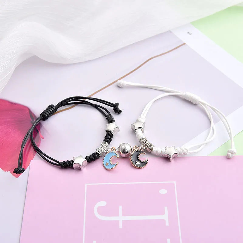Magnetic couple bracelet pair with alloy electroplating in various designs including clover and crown patterns