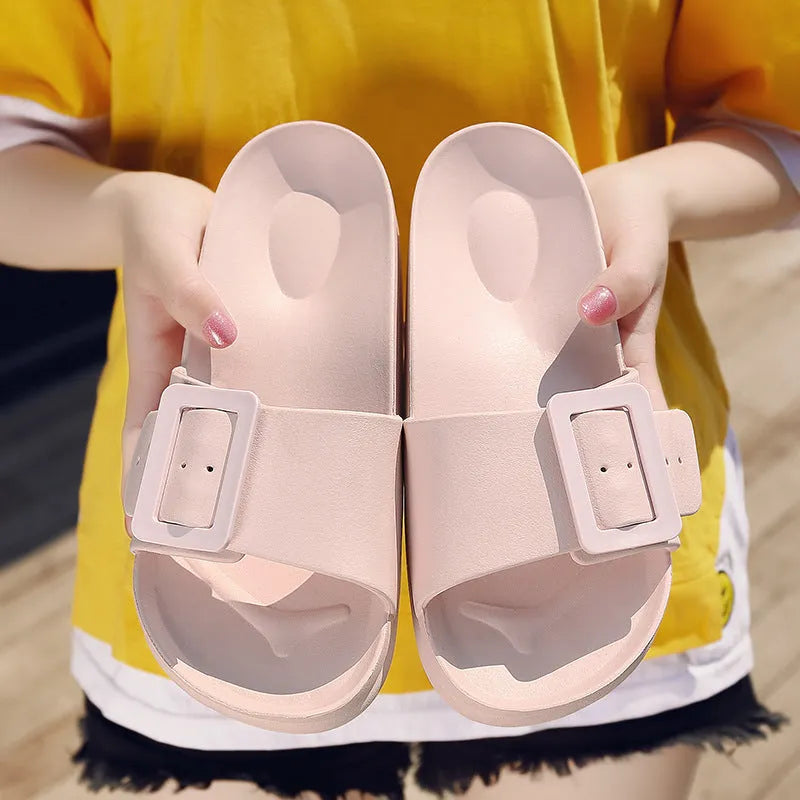 Women's grey blue buckle fastening flip-flop sandals with soft EVA sole on a white background.