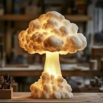Modern art mushroom cloud table lamp with USB power cable on a desk.