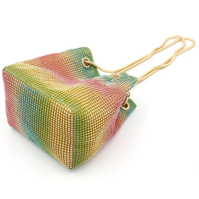 Rhinestone bucket bag with sparkling coverage and adjustable shoulder straps