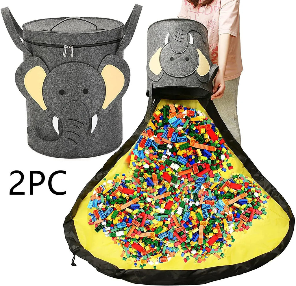 Green cube-shaped felt storage bag with pull rope lying flat as a play mat.