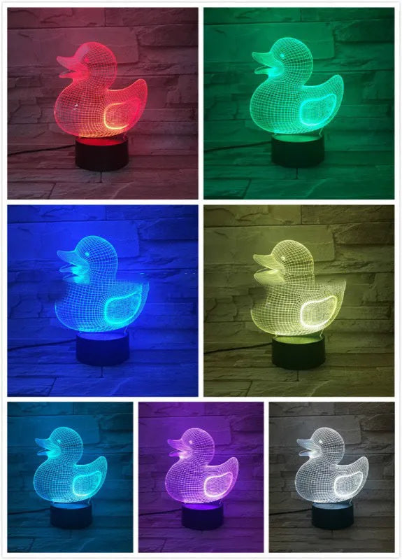 Little yellow duck 3D night light with multi-colour LED glow on an ABS base, showing remote control.