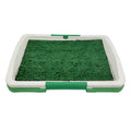 Green artificial grass dog toilet patch with plastic training tray and removable collection base.
