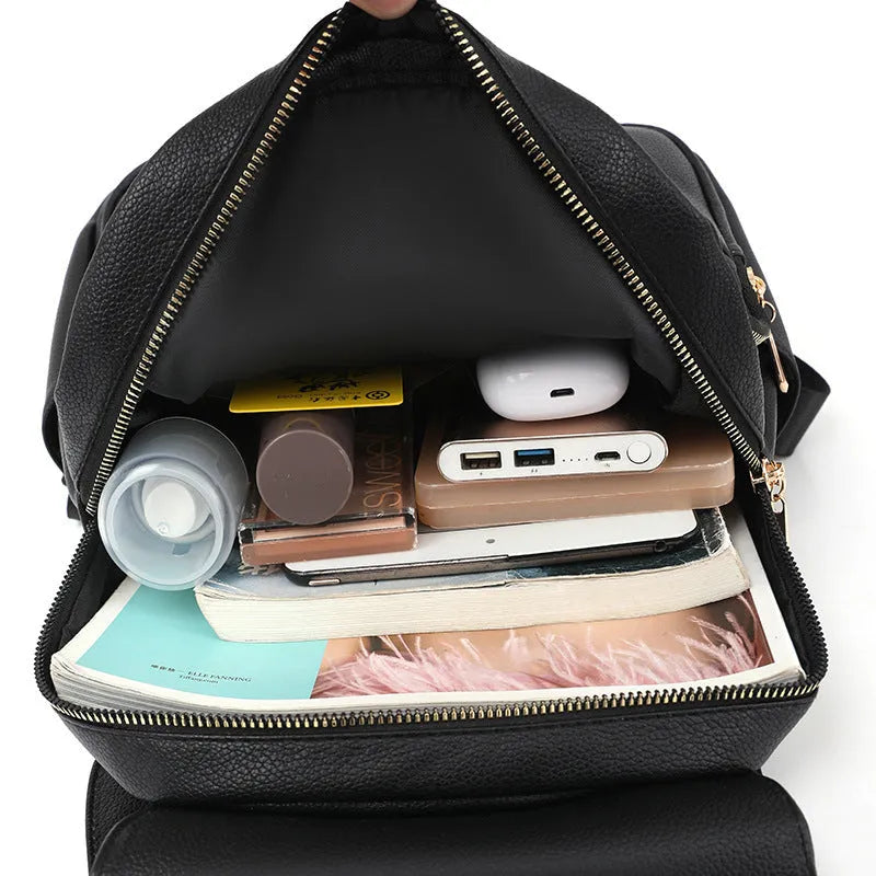 Women's textured leather backpack in black with three-dimensional pockets and street style design