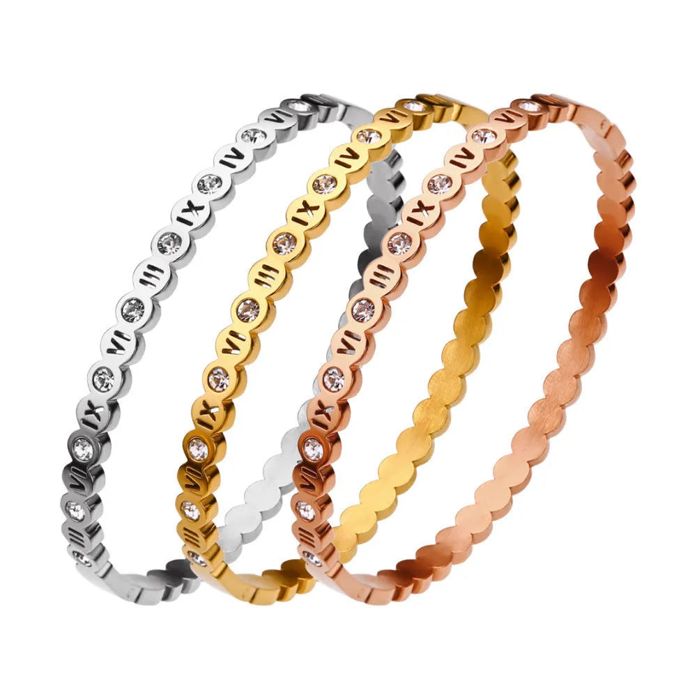 Korean style titanium steel bracelet with a numeric charm, shown in gold, rose gold, and steel colour options.