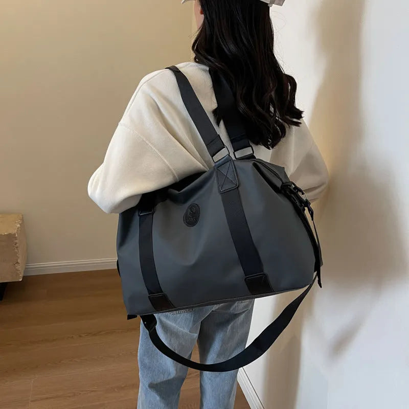 Large waterproof Oxford cloth travel bag in solid colour with 36-55L capacity for short-distance leisure travel