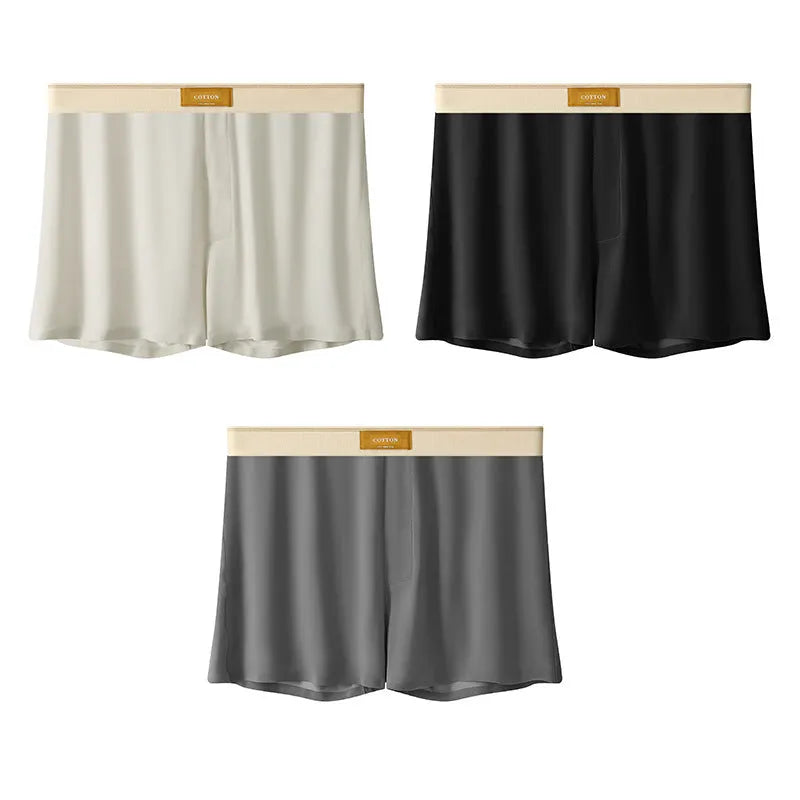 Men's loose fit ice silk underwear in solid colours showing mid-waist design and breathable fabric texture.