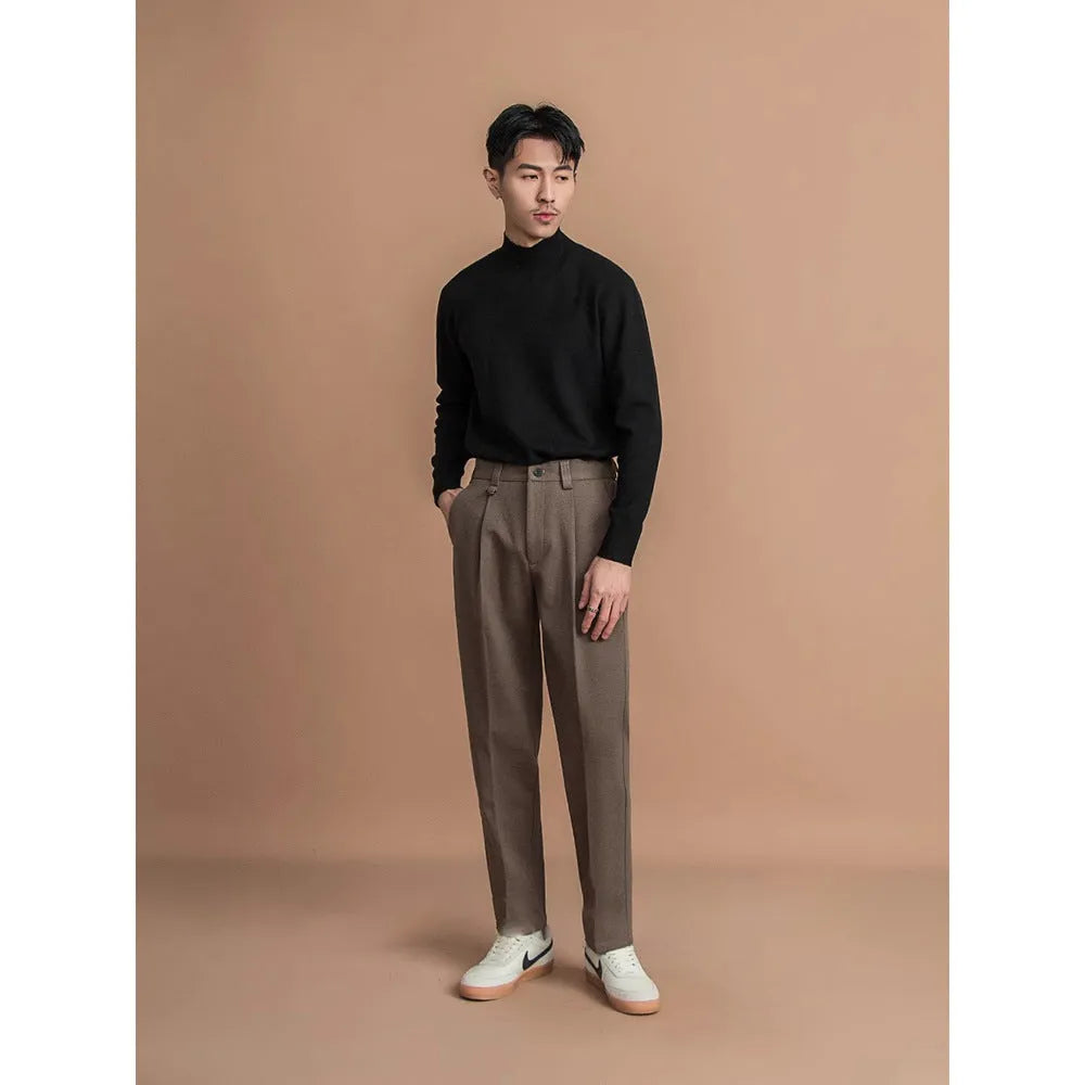 Men's straight leg polyester trousers in black on a hanger, business casual style