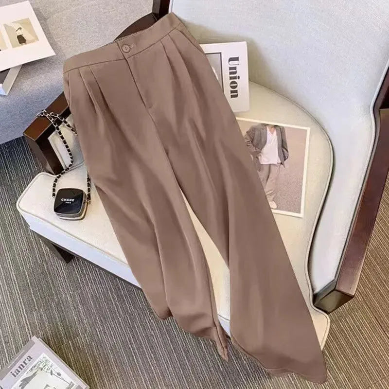 Women's loose fit polyester top and pants set in khaki colour on a hanger