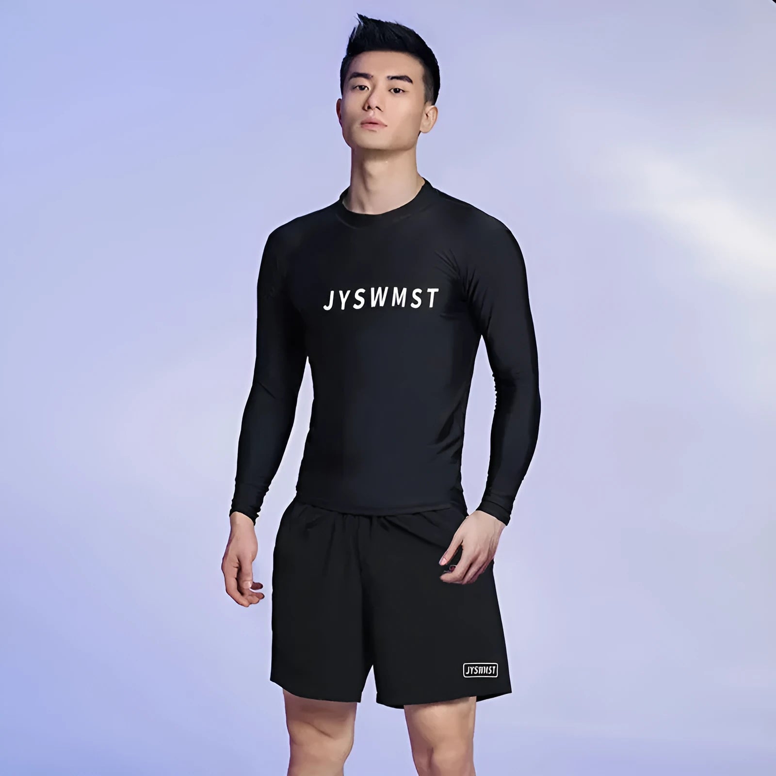 Men's two-piece polyester swim set showing short-sleeved swim top and matching trunks on a hanger.