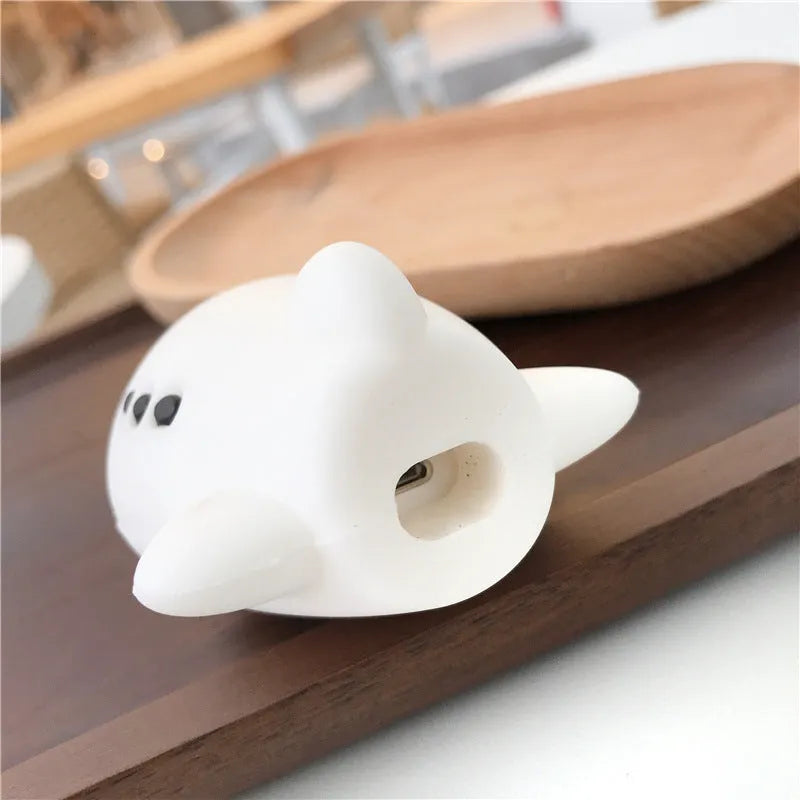 Blue silicone flip case for AirPods 1 and 2 with cartoon aeroplane headset design and attached lanyard hook.
