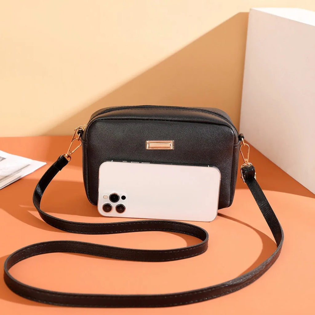 Solid colour PU ladies' shoulder bag with three-dimensional pockets in urban simplicity style