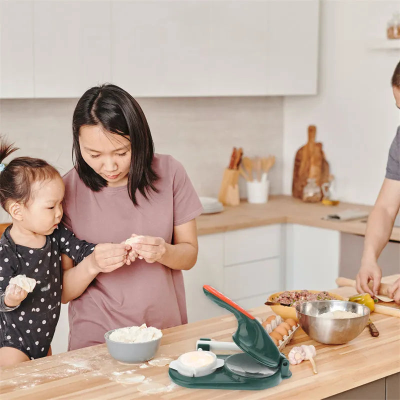 3 in 1 plastic dumpling maker with ergonomic handle and rolling pin in white on a table