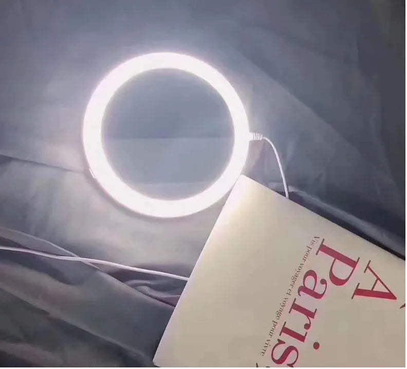 White foldable LED vanity mirror with double-sided magnification and USB charging port