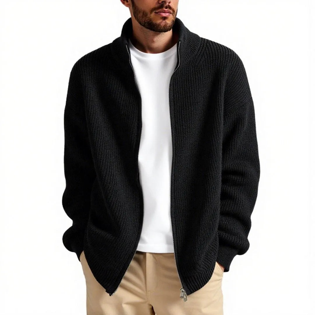 Man wearing a loose grey men's cardigan sweater, a casual acrylic knitwear piece for leisure.