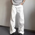 Man wearing loose straight-leg white denim jeans with a wide leg opening.