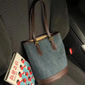 Blue denim patchwork one-shoulder bucket handbag with a large opening.