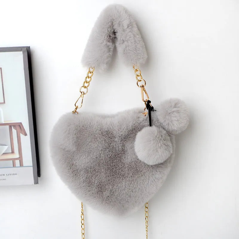 Heart-shaped women's plush handbag with soft texture and detachable shoulder strap in medium size