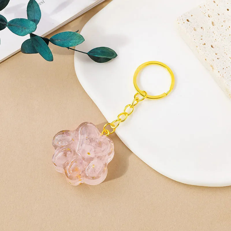 Natural crystal cat's paw keychain pendant charm in one of ten crystal types including pink crystal and amethyst.