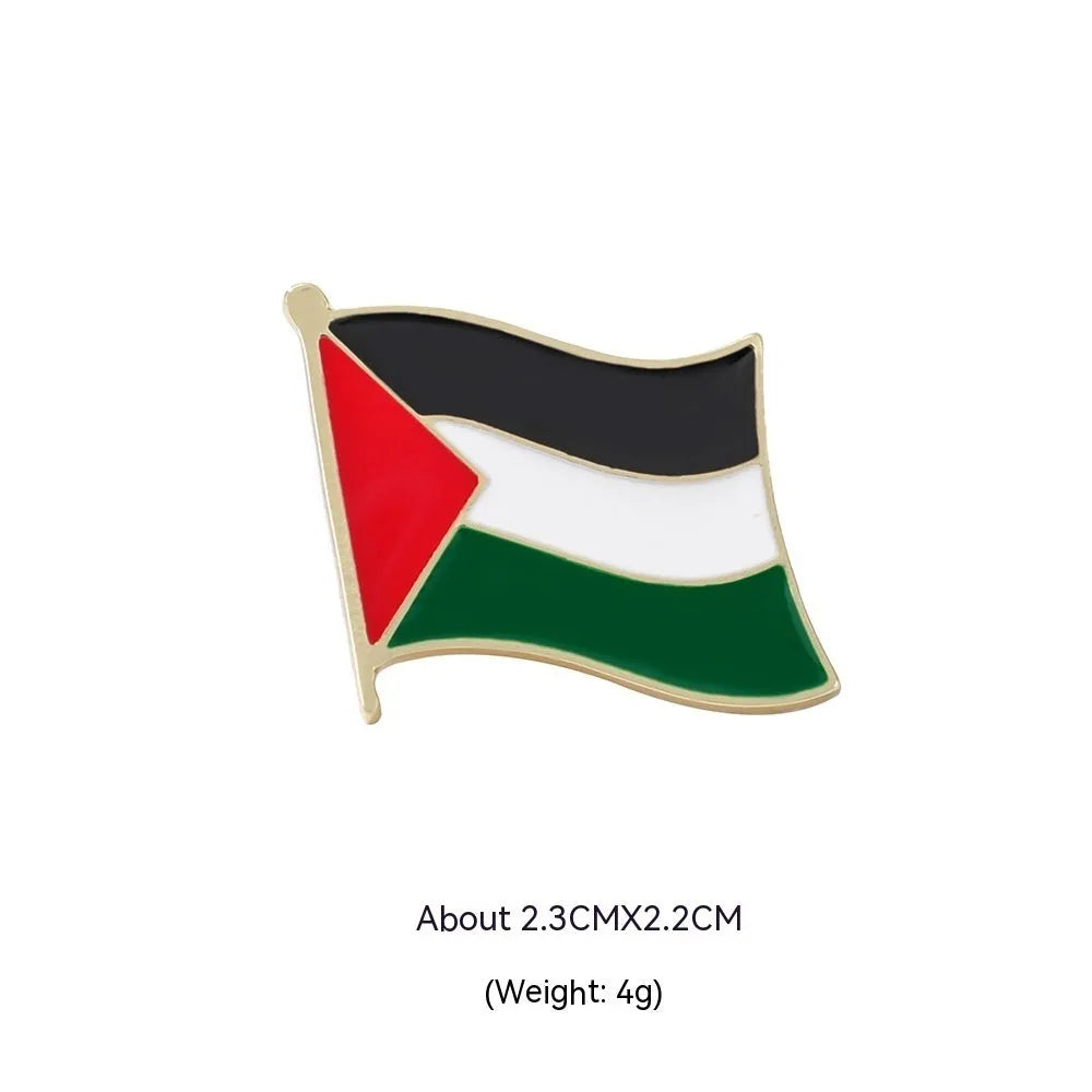 Square corrugated alloy brooch with Palestinian flag design on a neutral background