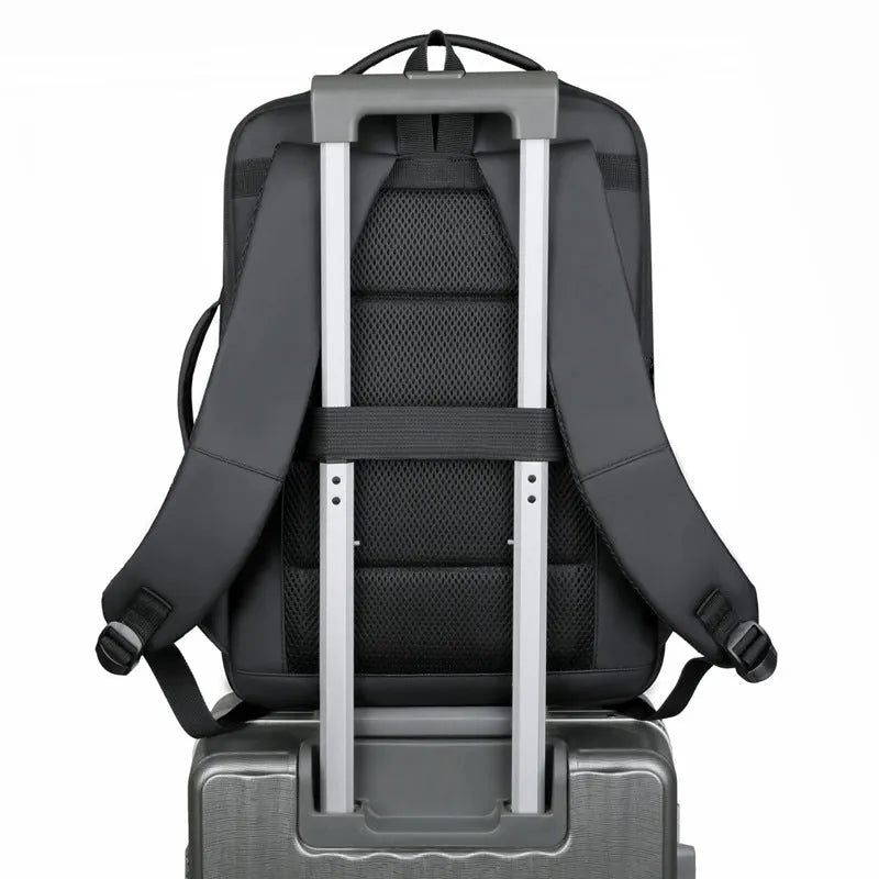 Black or grey waterproof Oxford cloth backpack with curved shoulder straps showing 20-35 litre capacity