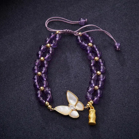Handmade purple amethyst crystal bracelet with multi-treasure natural stone beads on white background