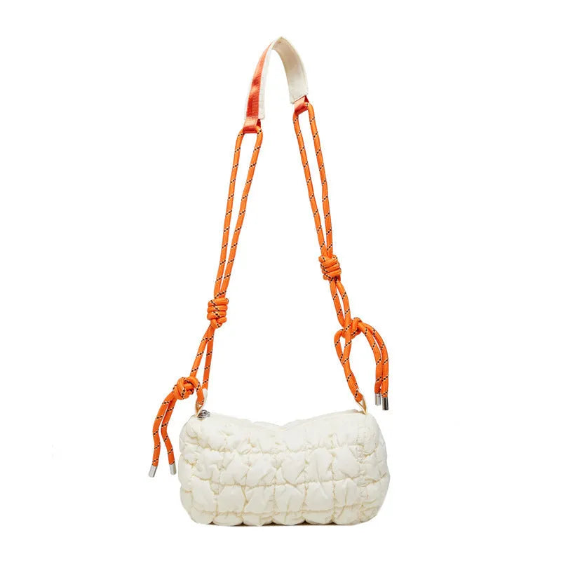 Soft pillow-shaped nylon messenger bag in multiple colours with a single shoulder strap.