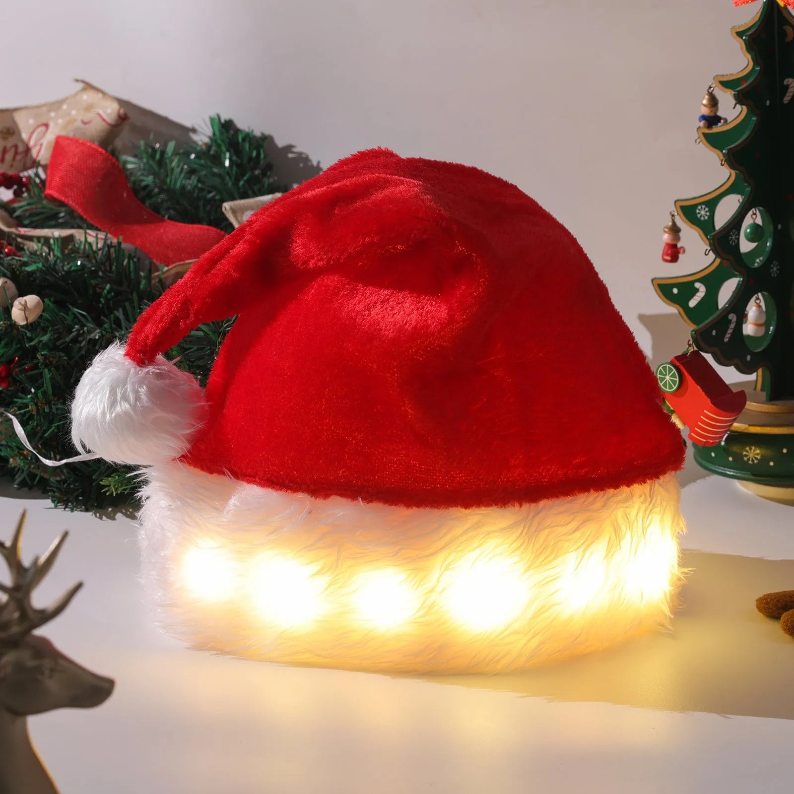 Red and white plush Santa hat with integrated multi-colour LED lights lit up around the brim.