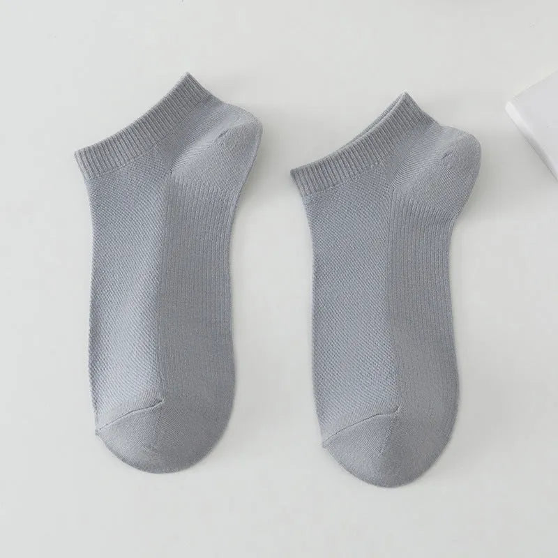 Men's solid colour polyester low-cut boat socks shown in one of six available colour options