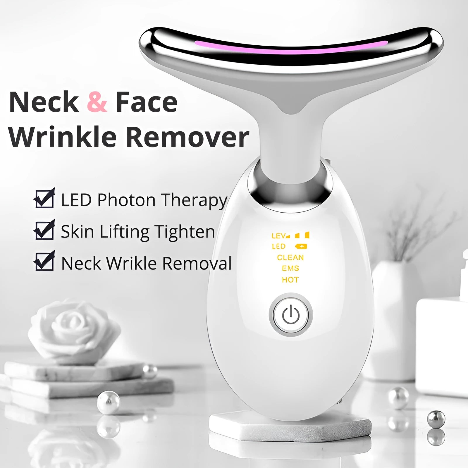 White EMS thermal neck lifting massager with LED lights, shown with USB cable and moisturiser.