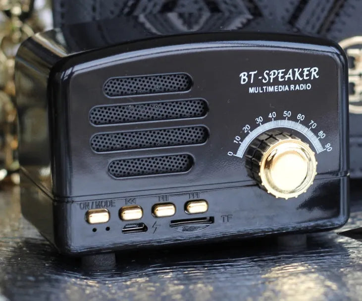 Vintage wood grain finish Bluetooth speaker showing front controls and compact 93x70x59mm dimensions