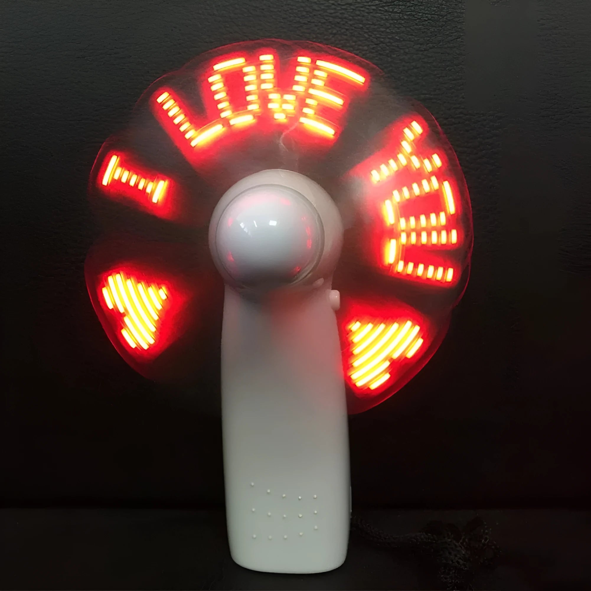 White handheld mini fan with flashing LED I Love You pattern in blue and red colours