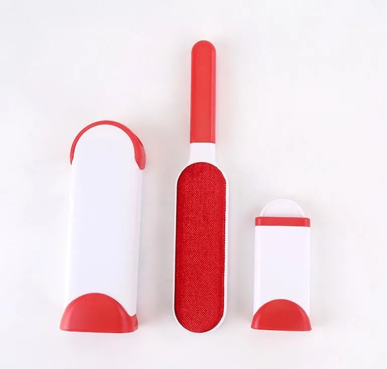 Blue reusable pet hair removal comb with double-sided brush head next to its self-cleaning base.