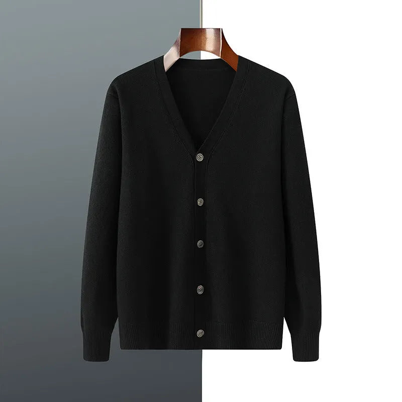 Man wearing a loose V-neck cardigan coat in Andy Velvet fabric, showing the long sleeves and available colour options.