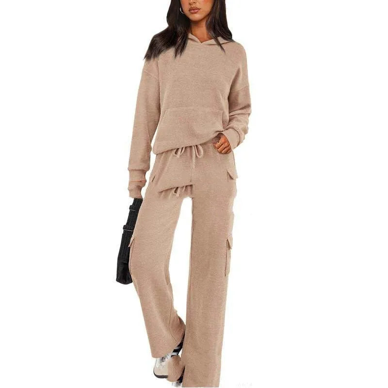 Women's polyester leisure sports suit set showing long sleeve top and matching trousers in multiple colour options