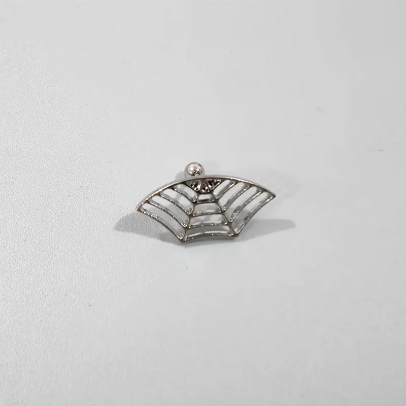 Spider web design metal stud earrings in gold or silver electroplated finish.
