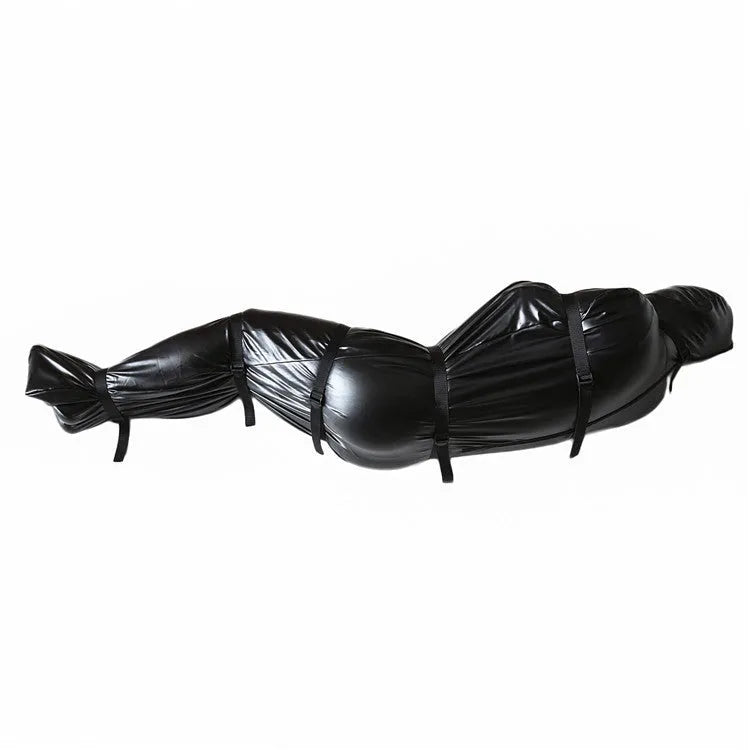 Black patent leather bondage suit with six ratchet tie down pieces for full body restraint