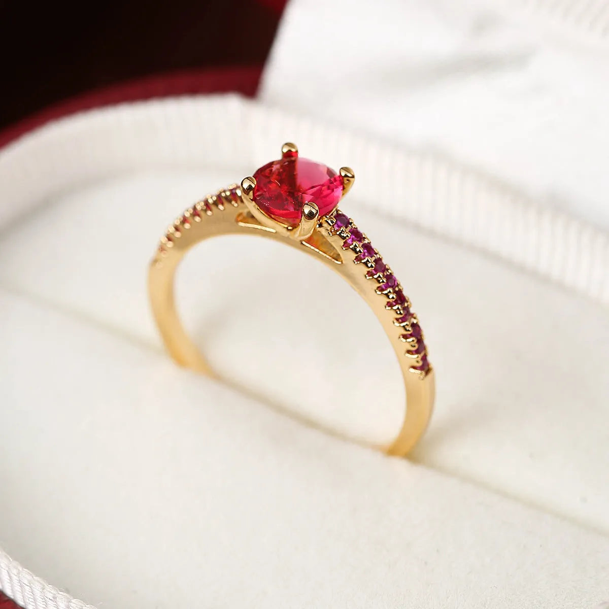 Geometric hexagon copper ring with colourful zircon stones in a metallic electroplated finish.